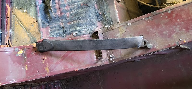 The right seat left lower mounting. This has a long plastic cover.